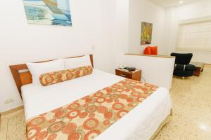 מיטה או מיטות בחדר ב-HOTEL OSCAR Tradición