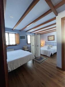 Postel nebo postele na pokoji v ubytování Hotel Rural As Laguas