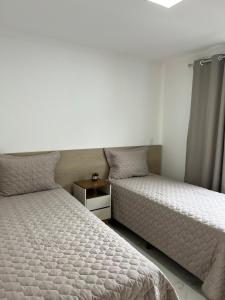 เตียงในห้องที่ Apartamento Encantador Centro Santa Teresa