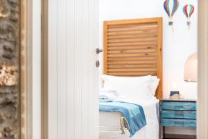 A bed or beds in a room at The Old Court Council Luxury mansion by Ifigeneia