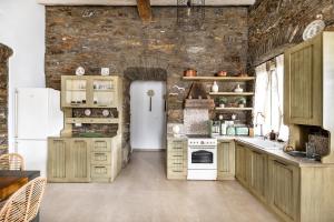 A kitchen or kitchenette at The Old Court Council Luxury mansion by Ifigeneia