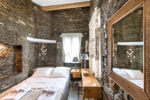 A bed or beds in a room at The Old Court Council Luxury mansion by Ifigeneia