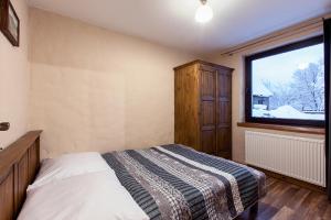 Posteľ alebo postele v izbe v ubytovaní ARAMIKA apartamenty