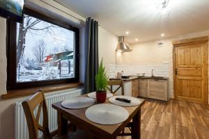 Kuchyňa alebo kuchynka v ubytovaní ARAMIKA apartamenty