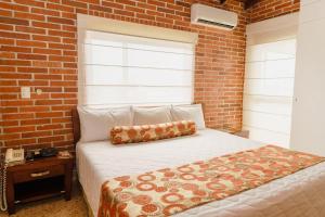 Postel nebo postele na pokoji v ubytování HOTEL OSCAR Tradición