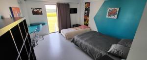 Łóżko lub łóżka w pokoju w obiekcie VILLA INATTENDUE