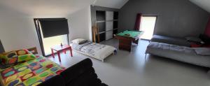 Łóżko lub łóżka w pokoju w obiekcie VILLA INATTENDUE
