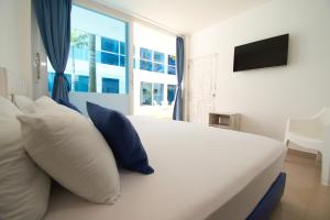 Voodi või voodid majutusasutuse Hotel Palma Linda toas