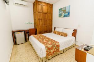 Postel nebo postele na pokoji v ubytování HOTEL OSCAR Tradición
