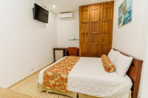 Postel nebo postele na pokoji v ubytování HOTEL OSCAR Tradición