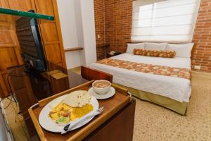 Postel nebo postele na pokoji v ubytování HOTEL OSCAR Tradición