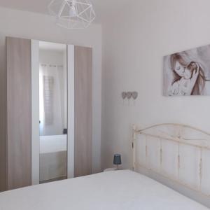 Łóżko lub łóżka w pokoju w obiekcie Casa Angelina Summer