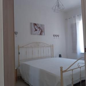 Łóżko lub łóżka w pokoju w obiekcie Casa Angelina Summer