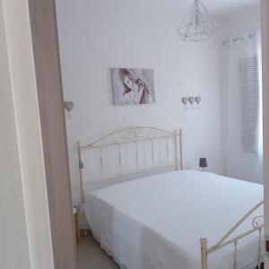 Łóżko lub łóżka w pokoju w obiekcie Casa Angelina Summer