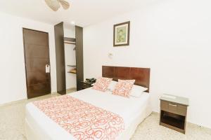 מיטה או מיטות בחדר ב-Hotel Las Molas