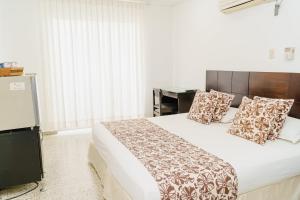 Postel nebo postele na pokoji v ubytování Hotel Las Molas