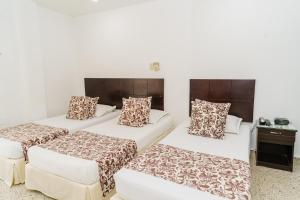 Postel nebo postele na pokoji v ubytování Hotel Las Molas