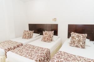 Postel nebo postele na pokoji v ubytování Hotel Las Molas