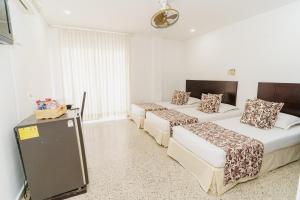 Postel nebo postele na pokoji v ubytování Hotel Las Molas