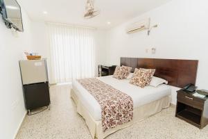 Postel nebo postele na pokoji v ubytování Hotel Las Molas