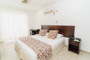 Postel nebo postele na pokoji v ubytování Hotel Las Molas