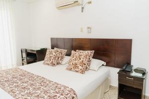 Postel nebo postele na pokoji v ubytování Hotel Las Molas