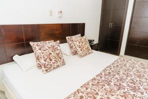 Postel nebo postele na pokoji v ubytování Hotel Las Molas