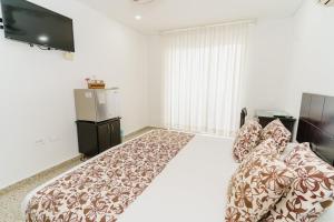 Postel nebo postele na pokoji v ubytování Hotel Las Molas