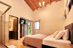 Letto o letti in una camera di Mansión by Bernalo Hotels