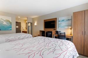 Hotel LeBlanc Best Western Signature Collection客房内的一张或多张床位