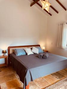 מיטה או מיטות בחדר ב-Chales Barra Grande
