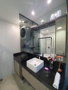 Een badkamer bij Vertigo Premium Studios - Luxo no 23º Andar