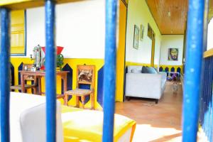 a living room with a couch and a table at Casa Finca Villa Luz a 800 mts del Parque del Café in Montenegro +26 photos