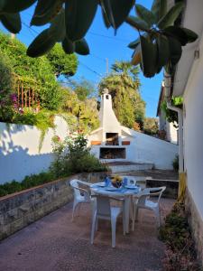 a table and chairs on the patio of a house at Cal Jamila in Cubelles
