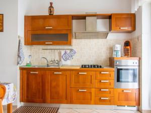 A kitchen or kitchenette at Appealing Apartment in Genoa with Sauna