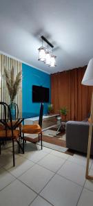 a living room with a couch and a table at Sweet Home in La Serena