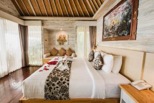 The Angkal Resort tesisinde bir odada yatak veya yataklar