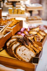 a bunch of different types of bread in boxes at Joondalup Resort in Perth