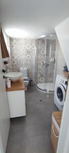 a bathroom with a shower and a toilet and a sink at Isavella's House in Pera Gyalos +47 photos