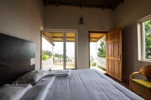 Postel nebo postele na pokoji v ubytování Tranqville Resorts
