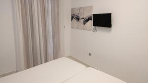 TV a/nebo společenská místnost v ubytování Constantine Fortezza Rooms