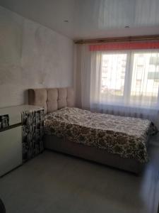 Katil atau katil-katil dalam bilik di Viršu street apartaments 5