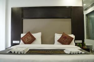 Postel nebo postele na pokoji v ubytování Hotel Anand Empire Near New Delhi Railway Station