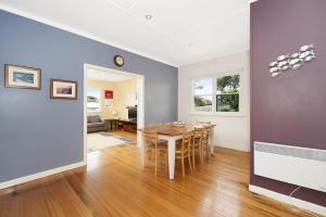 a kitchen and dining room with a table and chairs at Anderson in Apollo Bay