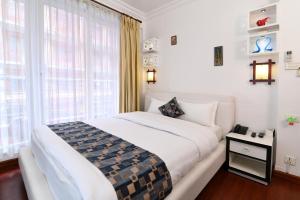 Rúm í herbergi á Hotel M Square Pvt.Ltd
