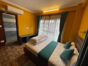 Postel nebo postele na pokoji v ubytování Munus Travel Home is "A Peaceful Home Away from the City"