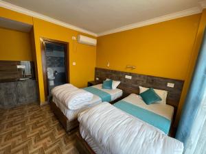 Postel nebo postele na pokoji v ubytování Munus Travel Home is "A Peaceful Home Away from the City"