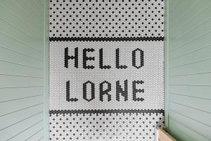 a hello home sign on a wall in a room at Joy Apartment 5 in Lorne