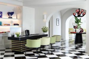 a lobby with a black and white checkered floor at Hotel Miramalfi in Amalfi