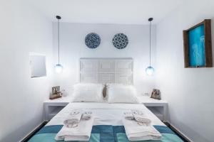 A bed or beds in a room at The Old Court Council Luxury mansion by Ifigeneia